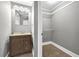 Bathroom featuring single sink vanity and walk-in closet at 2006 Conrad Se Ave, Atlanta, GA 30315