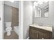 Bathroom featuring tub and shower, gray tile and single sink vanity at 2006 Conrad Se Ave, Atlanta, GA 30315