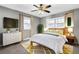 Bedroom with neutral carpet, two windows, and ceiling fan at 2006 Conrad Se Ave, Atlanta, GA 30315