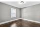 Neutral bedroom featuring a window, hardwood floors and white trim at 2006 Conrad Se Ave, Atlanta, GA 30315