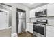 Updated kitchen with stainless steel appliances and access to other rooms in home at 2006 Conrad Se Ave, Atlanta, GA 30315