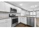 Bright kitchen with stainless appliances, subway tile backsplash, and granite countertops at 2006 Conrad Se Ave, Atlanta, GA 30315