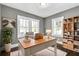 Bright home office with large windows, hardwood floors, and built-in shelving at 2006 Conrad Se Ave, Atlanta, GA 30315