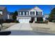 Beautiful two-story home with a two-car garage and a long driveway at 3285 Warbler Way, Cumming, GA 30041