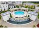 A community pool with lounge chairs surrounded by manicured grounds and water features at 331 S Esplanade, Alpharetta, GA 30009