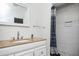 Bathroom showcasing vanity with granite countertop and tiled walk-in shower at 1073 Oakland Drive Sw Dr, Atlanta, GA 30310