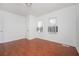 Empty bedroom with hardwood flooring and two windows offering natural light at 1073 Oakland Drive Sw Dr, Atlanta, GA 30310