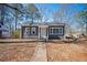 Charming single-story home with a gray exterior, white trim, and a well-manicured front yard at 1073 Oakland Drive Sw Dr, Atlanta, GA 30310