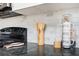 Kitchen countertop with modern appliances, utensils, and a marble backsplash at 1073 Oakland Drive Sw Dr, Atlanta, GA 30310