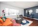 The living room features a colorful rug, a blue accent wall, and natural light from the window at 1073 Oakland Drive Sw Dr, Atlanta, GA 30310