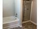 Bright bathroom with a shower and separate soaking tub at 11978 Lovejoy Crossing Way, Hampton, GA 30228