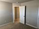 View of carpeted bedroom featuring a large closet, neutral paint, and carpet at 11978 Lovejoy Crossing Way, Hampton, GA 30228