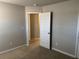 Bedroom featuring neutral walls, plush carpet, and white trim at 11978 Lovejoy Crossing Way, Hampton, GA 30228