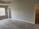 Spacious bedroom features neutral paint, carpet floors, and walk-in closet at 11978 Lovejoy Crossing Way, Hampton, GA 30228