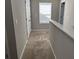 Hallway features neutral walls and carpeted floors at 11978 Lovejoy Crossing Way, Hampton, GA 30228