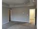 Neutral toned main bedroom with trey ceiling and carpeted floors at 11978 Lovejoy Crossing Way, Hampton, GA 30228