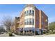 Beautiful brick building with outdoor dining and a modern architectural design under a clear blue sky at 1418 Dresden Ne Dr # 355, Atlanta, GA 30319