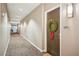 Welcoming hallway with neutral tones and an inviting wreath on the door, creating a warm entrance at 1418 Dresden Ne Dr # 355, Atlanta, GA 30319