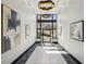 Bright lobby with modern lighting, artistic décor, and large windows, creating an inviting entrance at 1418 Dresden Ne Dr # 355, Atlanta, GA 30319