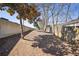 Outdoor mulch walkway lined by a concrete wall and wood fence offering a natural walking path at 1418 Dresden Ne Dr # 355, Atlanta, GA 30319