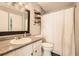 Updated bathroom features granite countertop, vanity, and shower with curtain at 3655 Habersham Ne Rd # 227, Atlanta, GA 30305