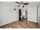 This bedroom features laminate wood floors, a modern ceiling fan, and neutral paint at 3655 Habersham Ne Rd # 227, Atlanta, GA 30305