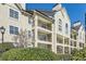 Exterior view of multi-story condominium building with private balconies and manicured landscaping at 3655 Habersham Ne Rd # 227, Atlanta, GA 30305