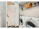 This laundry room includes a washer and dryer, shelving and a storage area at 3655 Habersham Ne Rd # 227, Atlanta, GA 30305