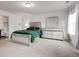 Bedroom with carpet, and modern furniture. A window to the right with natural light at 6356 Kennonbriar Ct, Lithonia, GA 30058