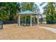 A gazebo with a picnic table underneath provides shade and a nice place for people to sit at 6356 Kennonbriar Ct, Lithonia, GA 30058