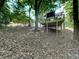 Backyard view showcasing the elevated deck and peaceful wooded surroundings at 1564 Bubbling Creek Rd, Brookhaven, GA 30319