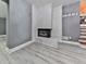 The basement features a white brick fireplace and gray walls at 1564 Bubbling Creek Rd, Brookhaven, GA 30319