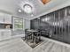 Chic dining room with a decorative wall, modern lighting, and a stylish table set at 1564 Bubbling Creek Rd, Brookhaven, GA 30319