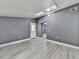 Spacious room featuring gray walls, light-colored flooring, and a skylight for natural light at 1564 Bubbling Creek Rd, Brookhaven, GA 30319