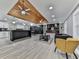 Bright, open-concept living room featuring wood plank ceiling, a fireplace and modern finishes at 1564 Bubbling Creek Rd, Brookhaven, GA 30319