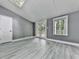 This living room features gray walls, French doors and a skylight at 1564 Bubbling Creek Rd, Brookhaven, GA 30319