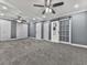 Spacious main bedroom features a large closet with a barn door and ceiling fan at 1564 Bubbling Creek Rd, Brookhaven, GA 30319