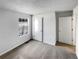 Cozy bedroom featuring neutral carpet, freshly painted light gray walls, and natural light from the window at 1831 Killarney Sw Dr, Marietta, GA 30008