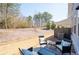 Cozy outdoor patio with seating and a tranquil backyard setting at 3037 Ferrington Way, Smyrna, GA 30080