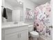 Bathroom with a flower designed shower curtain, a white vanity and a neutral wall color at 3037 Ferrington Way, Smyrna, GA 30080