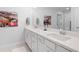 Bright bathroom with double sink vanity, white cabinets and quartz countertops at 3037 Ferrington Way, Smyrna, GA 30080
