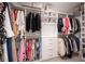 Walk-in closet with custom shelving and storage solutions to maximize organization at 3037 Ferrington Way, Smyrna, GA 30080