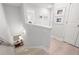 Hallway with natural light, light hardwood floors, and neutral paint; it exudes a bright, welcoming ambiance at 3037 Ferrington Way, Smyrna, GA 30080