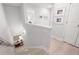 Upstairs landing showcasing hardwood floors, neutral paint and natural light from landing window at 3037 Ferrington Way, Smyrna, GA 30080