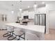 Kitchen featuring white cabinetry, an island with seating, and stainless steel appliances at 3037 Ferrington Way, Smyrna, GA 30080