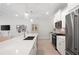 Modern kitchen with white cabinetry, stainless steel appliances and beautiful countertops at 3037 Ferrington Way, Smyrna, GA 30080