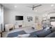 Open-concept living room with recessed lighting, kitchen view and hardwood style flooring at 3037 Ferrington Way, Smyrna, GA 30080