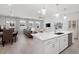 Bright open-concept kitchen and living room with recessed lighting and views from many windows at 3037 Ferrington Way, Smyrna, GA 30080