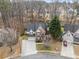 Aerial view of a well-maintained property, mature trees, and a spacious driveway at 3510 Estates Landing Nw Dr, Kennesaw, GA 30144