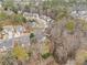 Serene aerial perspective of homes nestled among mature trees in a quiet residential area at 3510 Estates Landing Nw Dr, Kennesaw, GA 30144